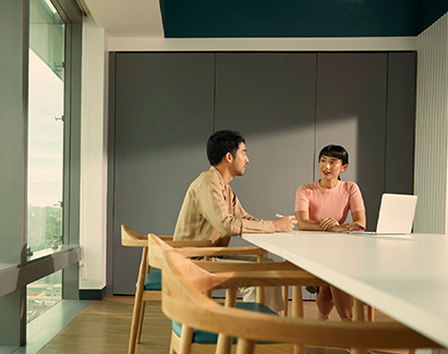 a man and woman sitting at a table